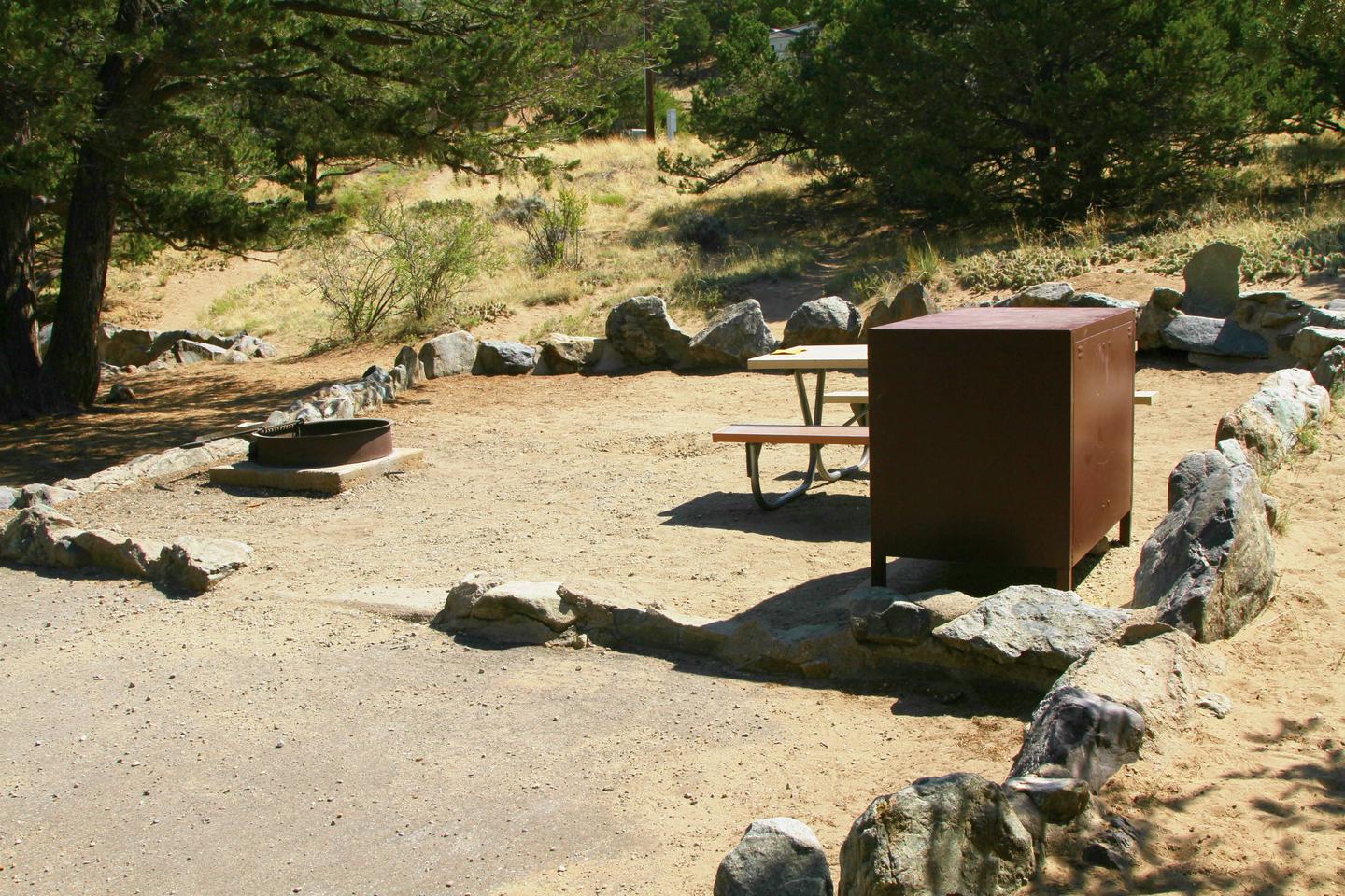 Side view of Site #75 tent pad, with bear box, picnic table, and fire ring.Site #75, Pinon Flats Campground