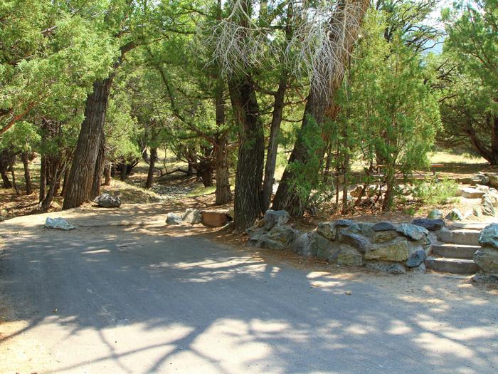 View of Site #54 parking pad and designated tent pad. Site has two sets of stairs, from parking and roadside.Site #54, Pinon Flats Campground