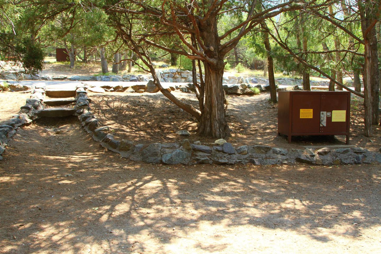 Back view of Site #53 tent pad showing the stair trail down from the parking area. Bear box to the right.Site #53, Pinon Flats Campground