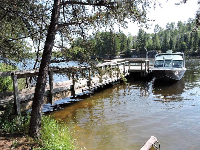 N41 - Voyageurs Narrows, view of boat access from water with boat tied to dock.