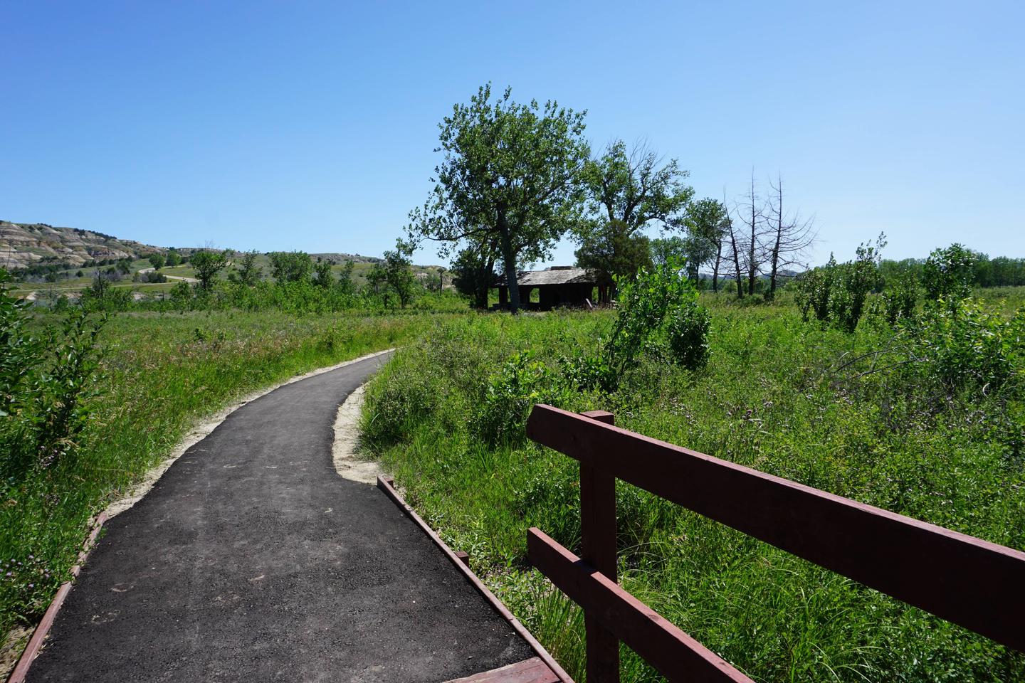 Bridge and blacktopped trail. The Little Missouri Nature Trail is adjacent to the campsite. 