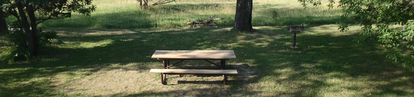 Picture of the picnic table and grill.  It is a short walk from the campsite. Photo of the picnic table and grill.  