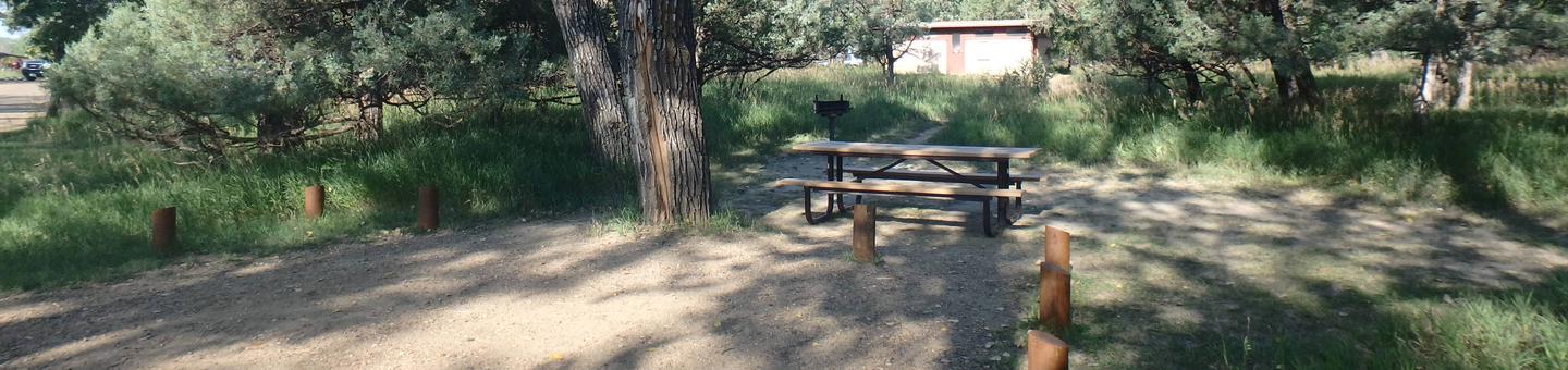 Site 69, backin site. The picnic table and grill are located behind the site. It is close to the bathroom.Site 69. 