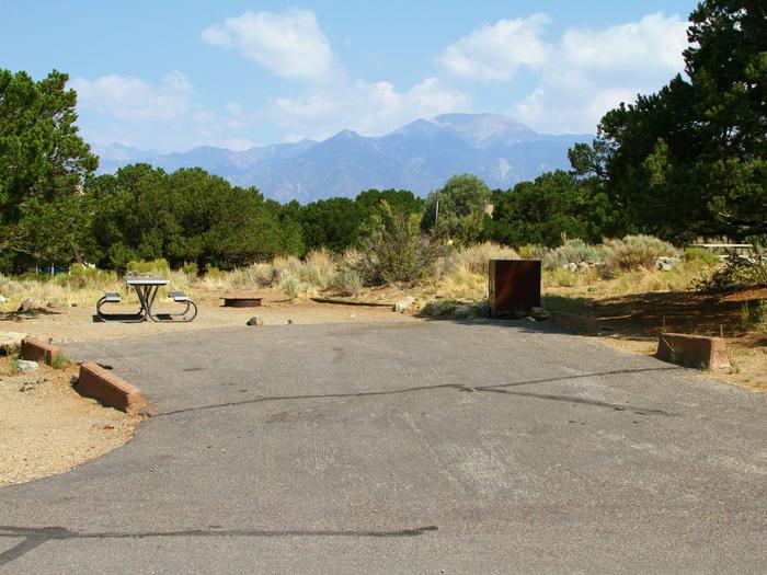 View of Site #41 parking pad, tent site, picnic table, fire ring, and bear box.  Parking pad is not flat, with a mild side tilted grade.Site #41, Pinon Flats Campground