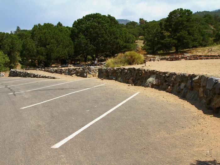 View of Accessible Group Site "C" parking area and tent site. Site has a gravel ramp from the parking area to the tent area, as well as stairs.Group Site C, Pinon Flats Campground