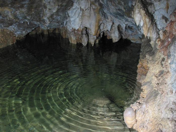Water drop ripples in clear water pool in Middle CaveMiddle Cave Lake