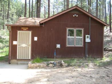 HORSETHIEF CABIN exterior, one step up from the parking area to screen door on left side of the cabin.Horsethief Cabin