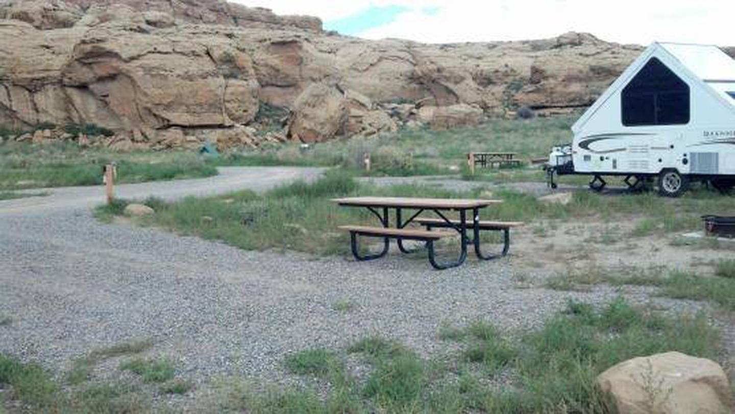RV Campsite with parking space, picnic table and fire grate