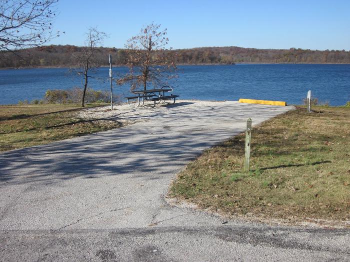 Electric site with paved/gravel pad, picnic table, fire ring, lantern post and great lake frontage.Ruark West site 21
