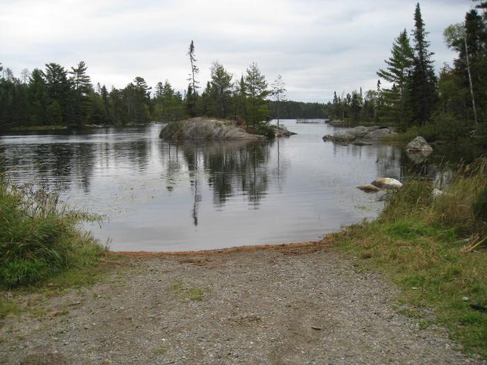 Picture of boatlanding.Rustic boatlanding.  Boatlanding area includes small parking area and outhouse.  There is no dock or concrete boat ramp.