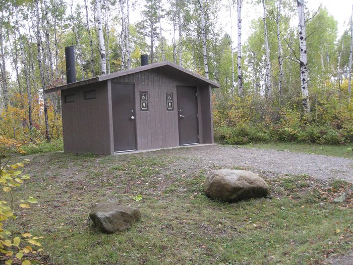 Picture of toilet building.Outhouse toilet building in a campground loop.