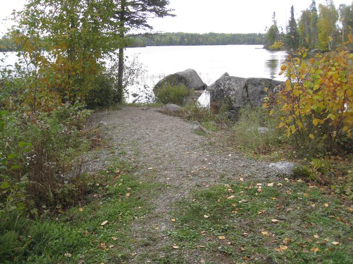 Picture of gravel path to lake.Access trail from camping area to lake.