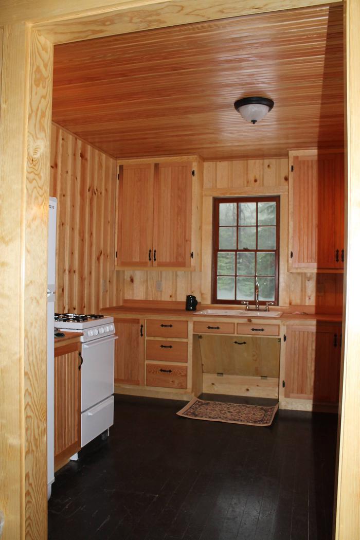 Kitchen of Peterson Cabin with Stove and refrigeratorKitchen in Peterson Cabin