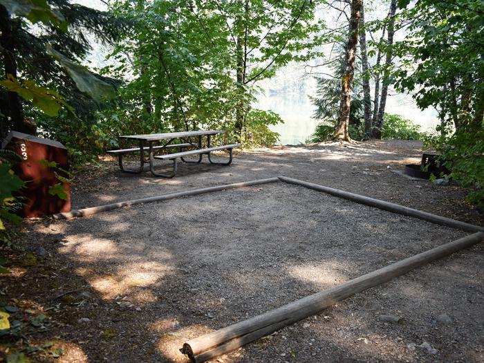 Food storage locker, picnic table, tent pad, and fire ringView of campsite