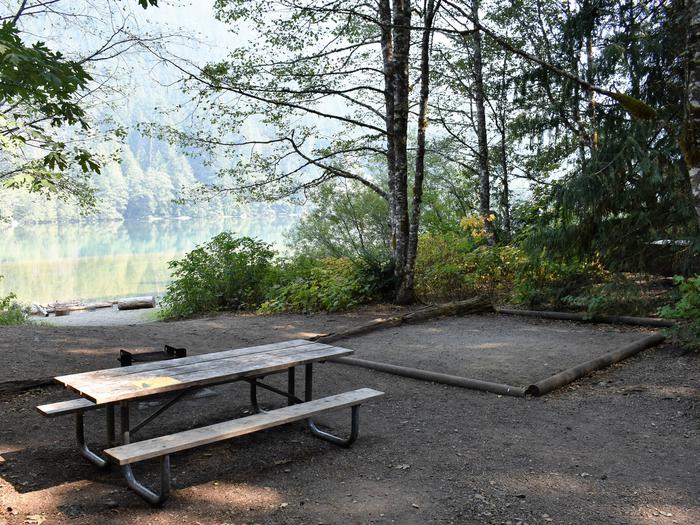 Picnic table and tent padView of campsite