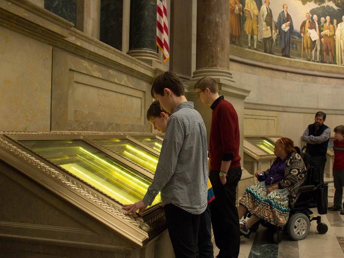 Visitors viewing the US Constitution in the Rotunda for the Charters of Freedom.