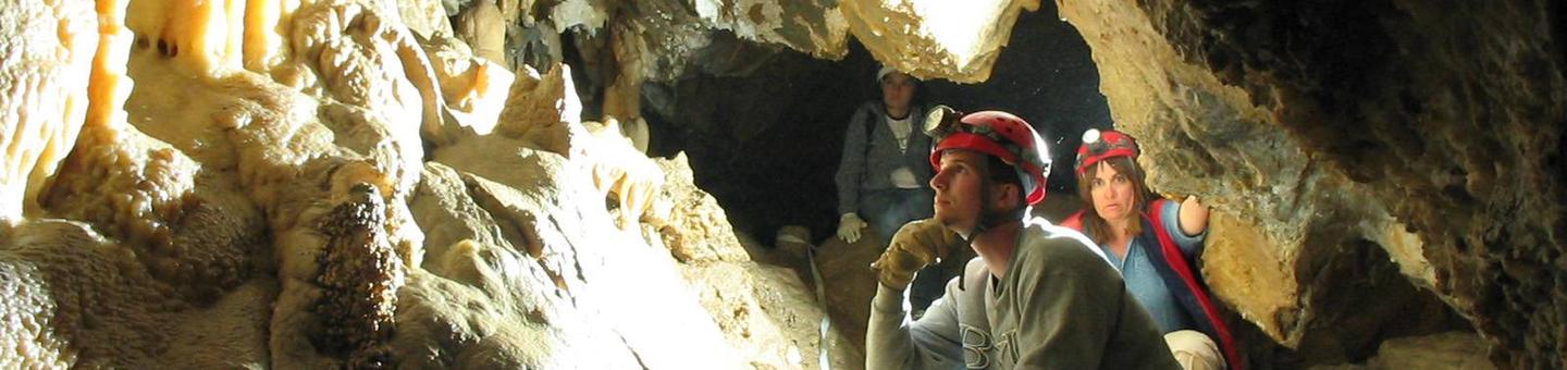 Cavers with hard hats and headlampsIntroduction to Caving Tour