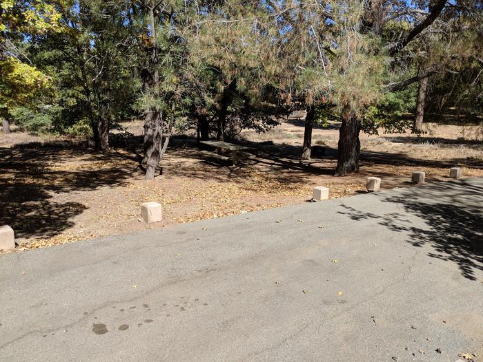 Burnt Rancheria Campground Site #33 featuring entrance to the wooded site and camping space.