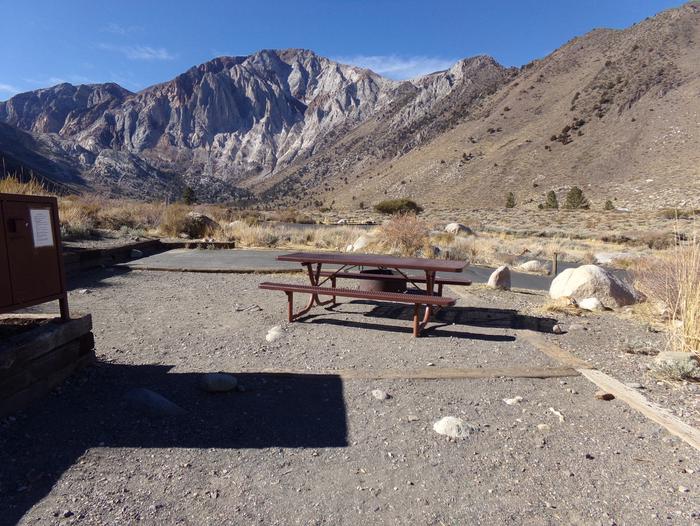 View of mountains and campground from campsite #4 at Convict Lake Campground.View of mountains and campground from campsite #4 at Convict Lake Campground featuring picnic table, fire pit, parking and camping space, and food storage. 