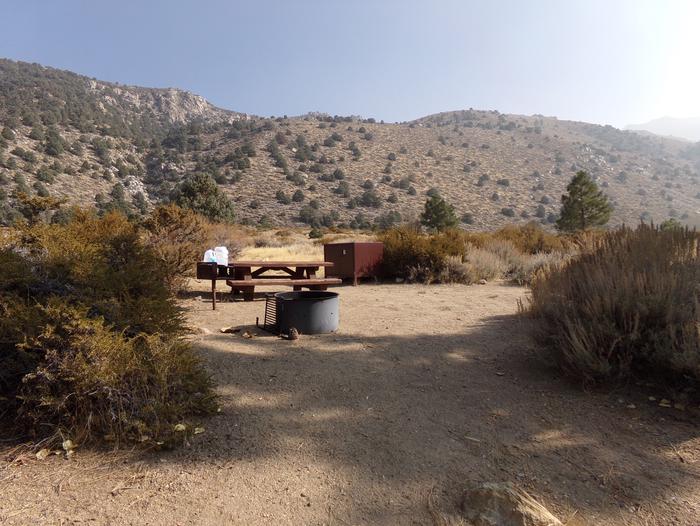 Four Jeffery Campground site #57 featuring picnic table, food storage, and fire pit.