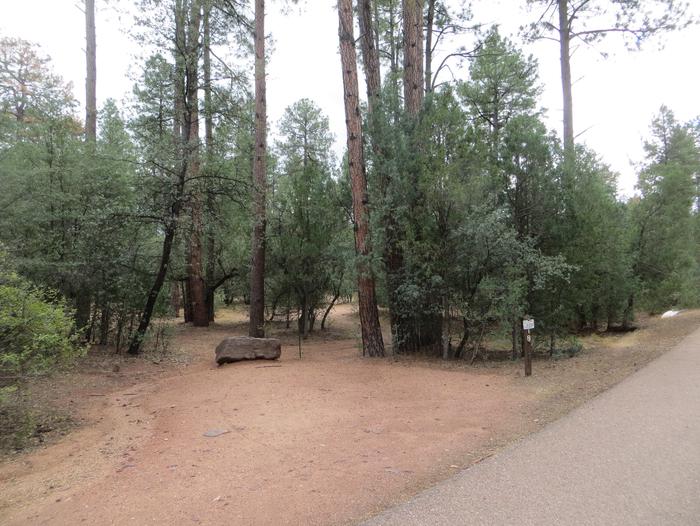 Houston Mesa, Black Bear Loop site #18 featuring parking, entrance to the wooded site, and picnic table.