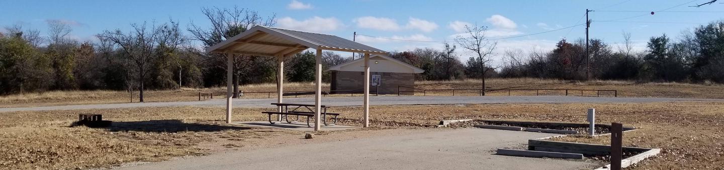 Site 1FPreview of Site 1F highlighting shaded picnic table and easy-access to shower and restroom facilities. 