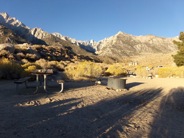 Lone Pine Campground site #04 featuring picnic area, fire pit, and camping space. 