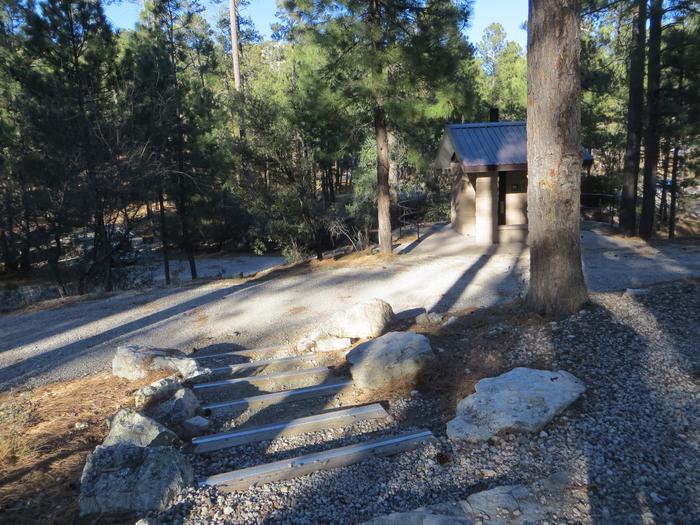 Rose Canyon Campground site #50 opposite side of campsite featuring stone steps leading to the restroom.