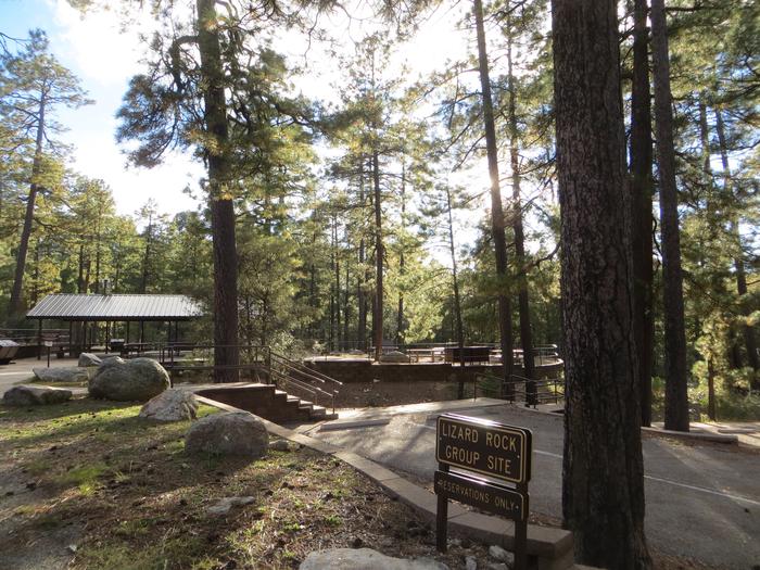 Rose Canyon Campground Group Site featuring parking spaces and stairs leading to the ramada picnic area. 