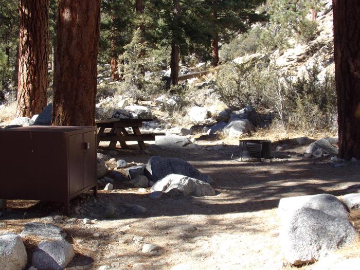 Mt. Whitney Portal Campground site #23 featuring the mountain top setting picnic area with fire pit. 