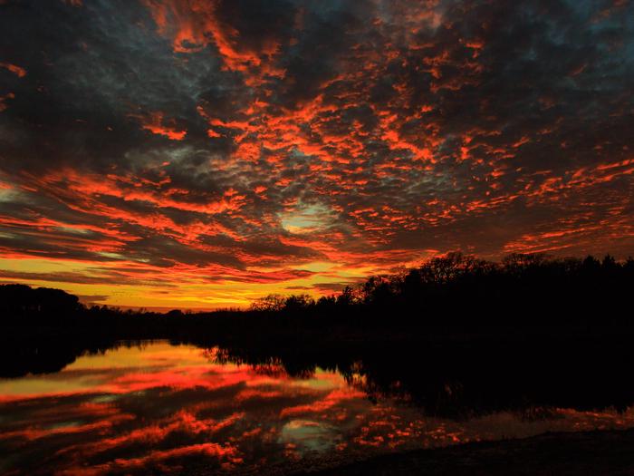 Sunset and reflection on Black Creek LakeBlack Creek Lake on the LBJ Grasslands in Texas