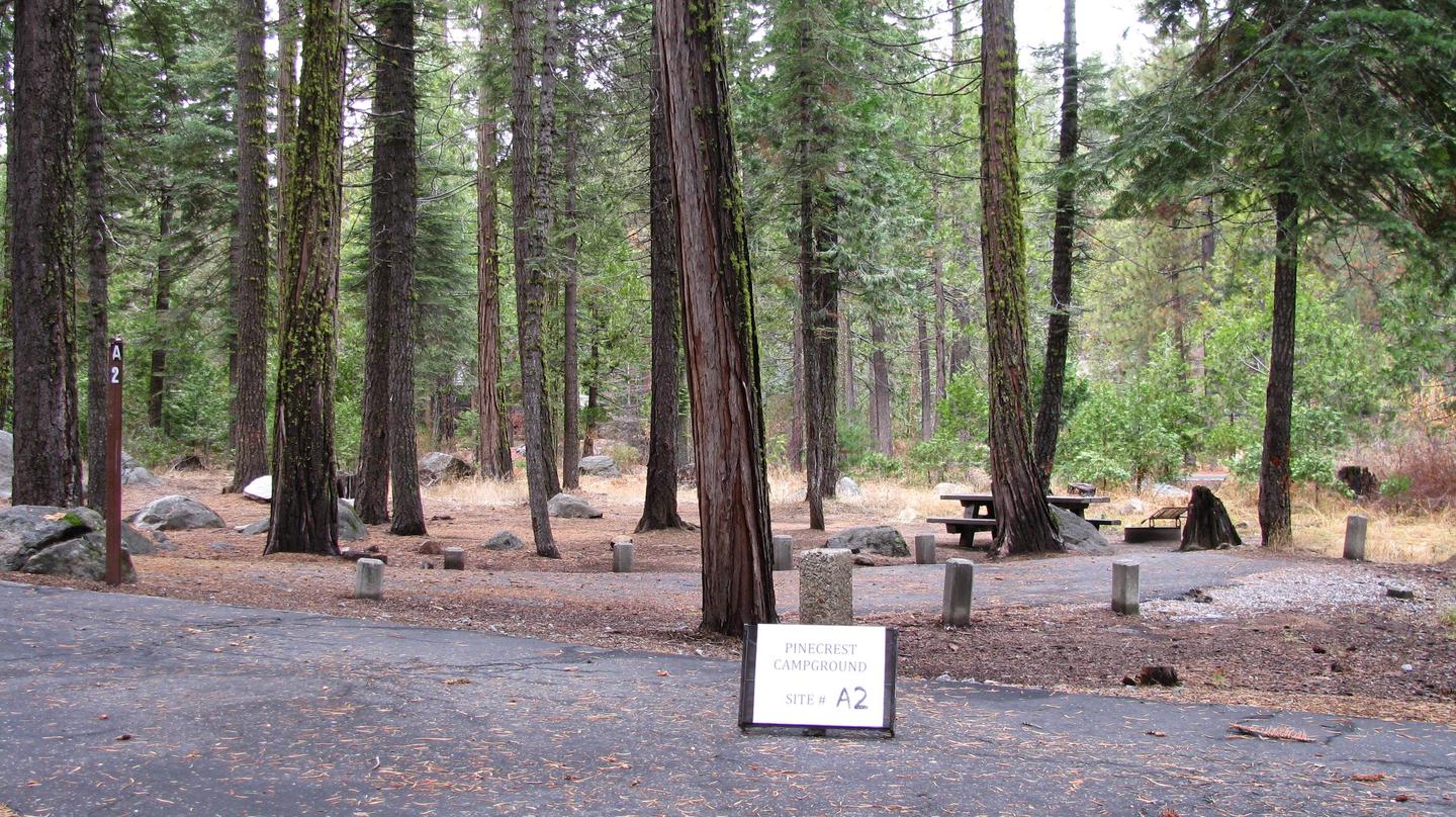 Paved site with picnic table and fire ringPinecrest Campground Site A2