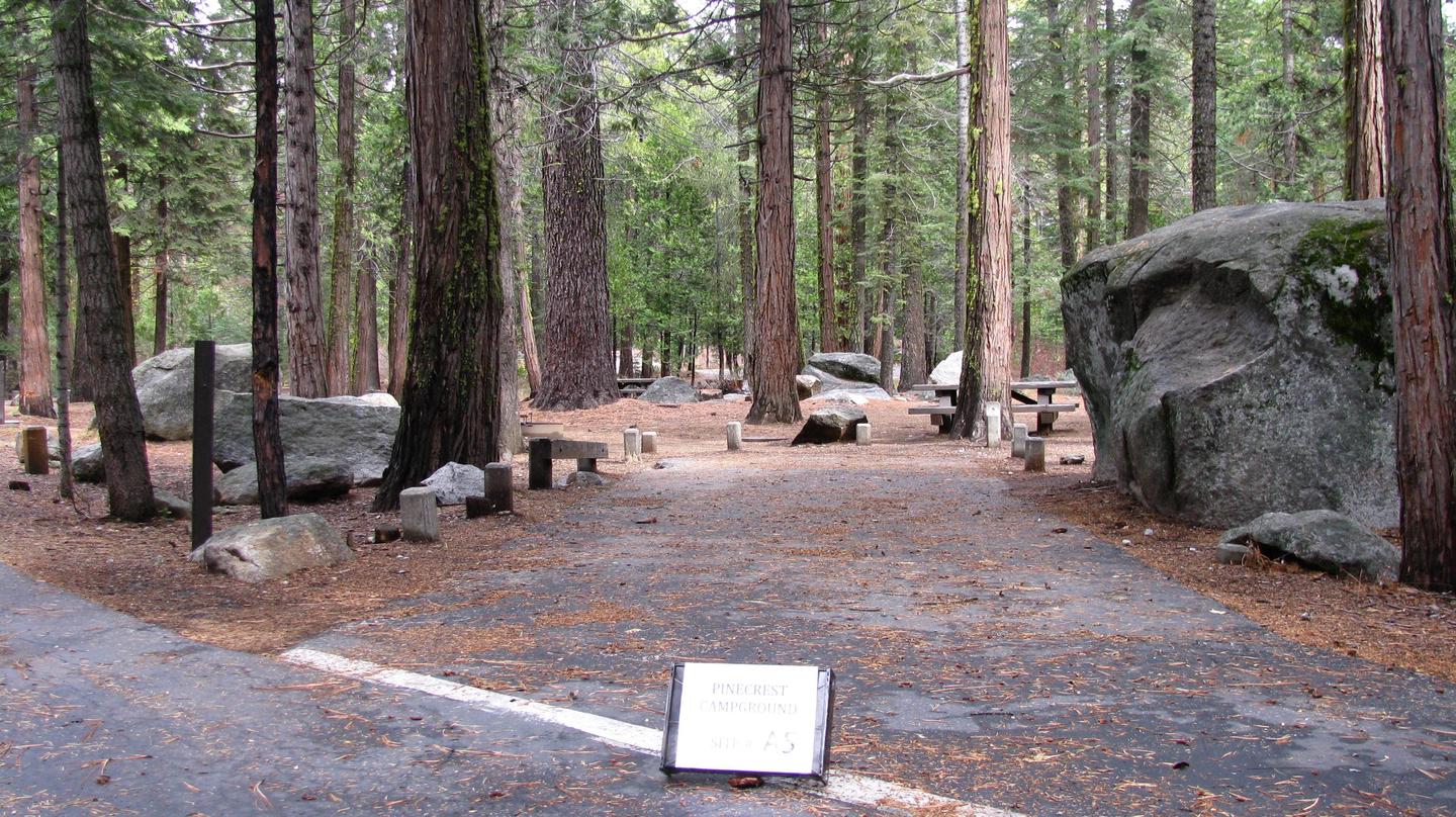 Paved site with picnic table and fire ringPinecrest Campground Site A5