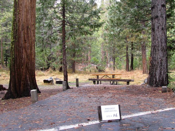Paved site with picnic table and fire ringPinecrest Campground Site A6