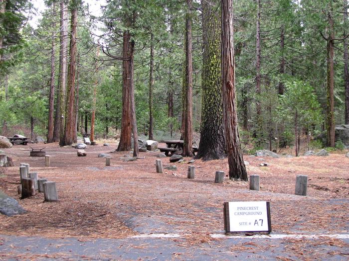 Paved site with picnic table and fire ringPinecrest Campground Site A7