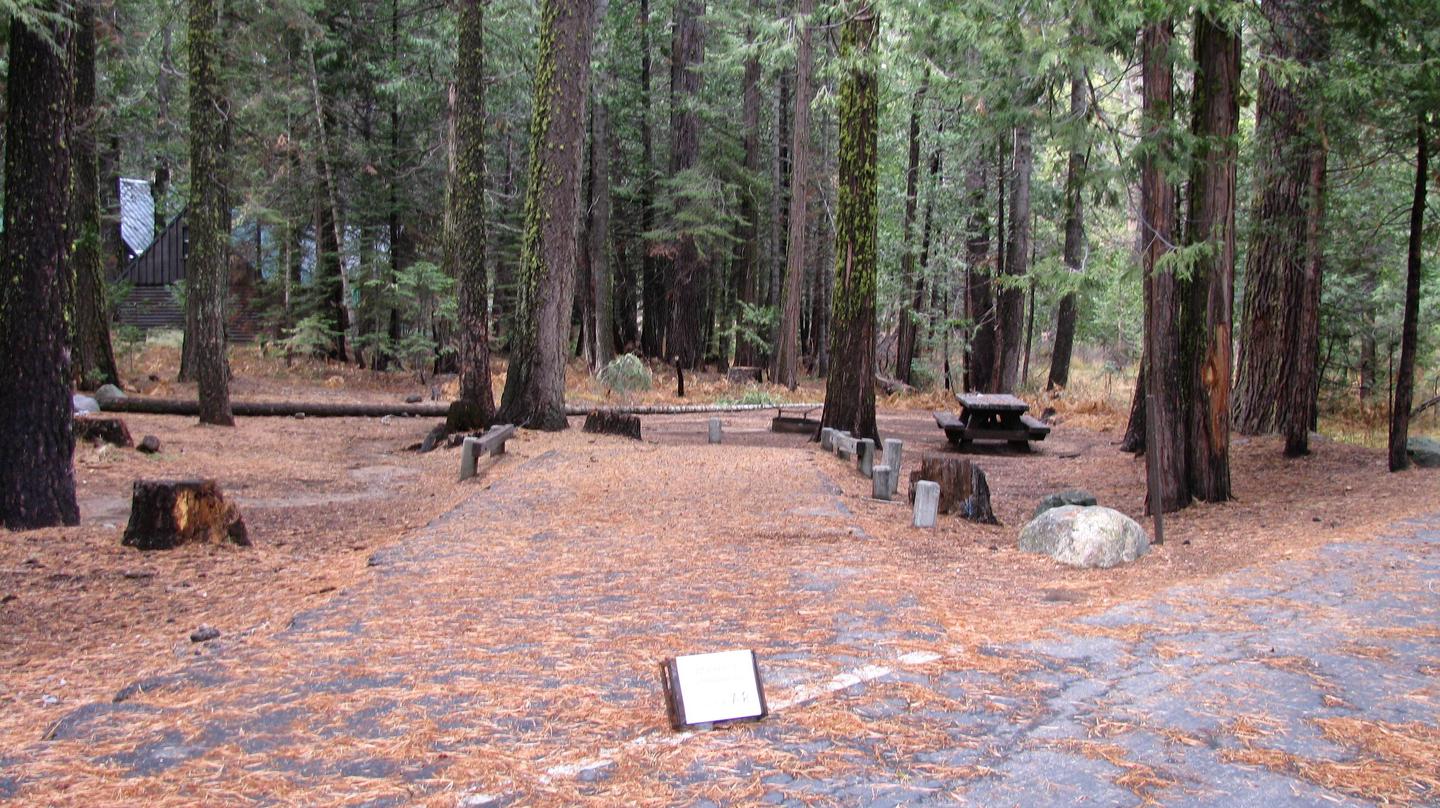 Paved site with picnic table and fire ringPinecrest Campground Site A8