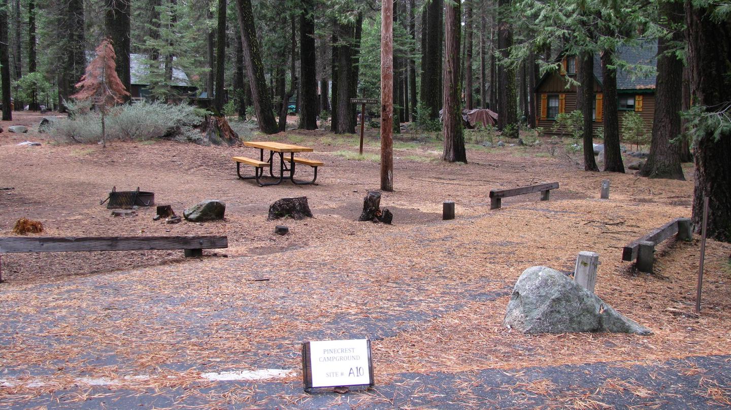 Paved site with picnic table and fire ringPinecrest Campground Site A10