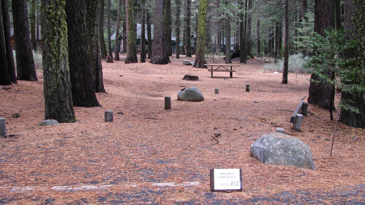 Paved site with picnic table and fire ringPinecrest Campground Site A12
