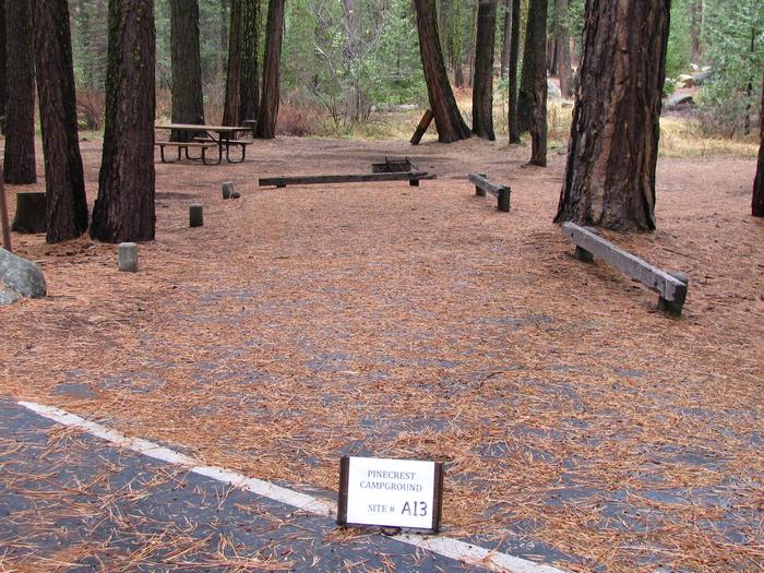 Paved site with picnic table and fire ringPinecrest Campground Site A13