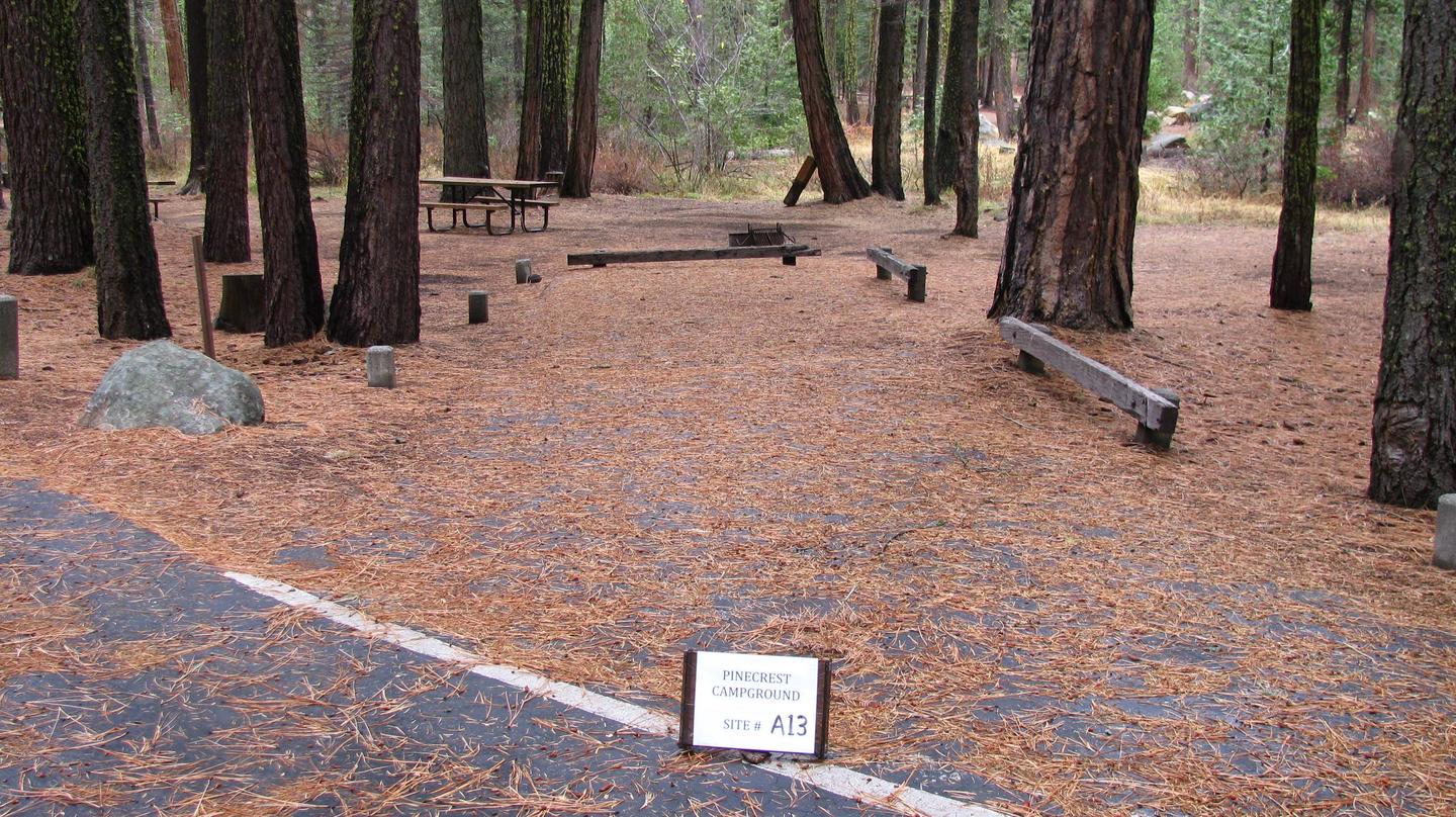 Paved site with picnic table and fire ringPinecrest Campground Site A13