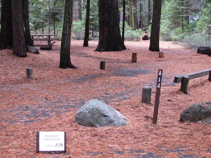 Paved site with picnic table and fire ringPinecrest Campground Site A14