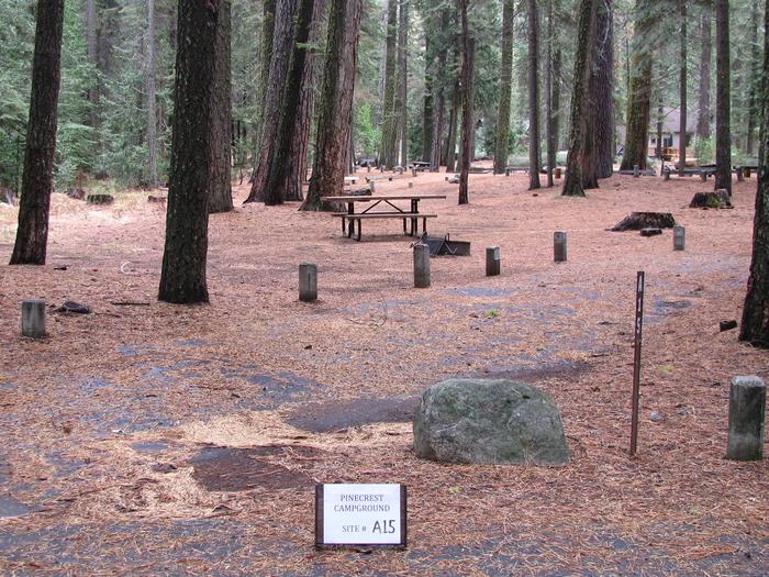 Paved site with picnic table and fire ringPinecrest Campground Site A15