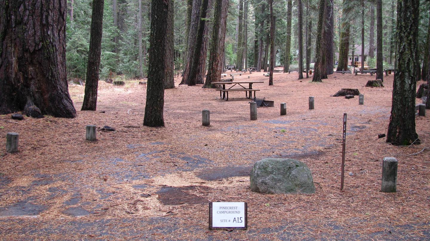 Paved site with picnic table and fire ringPinecrest Campground Site A15