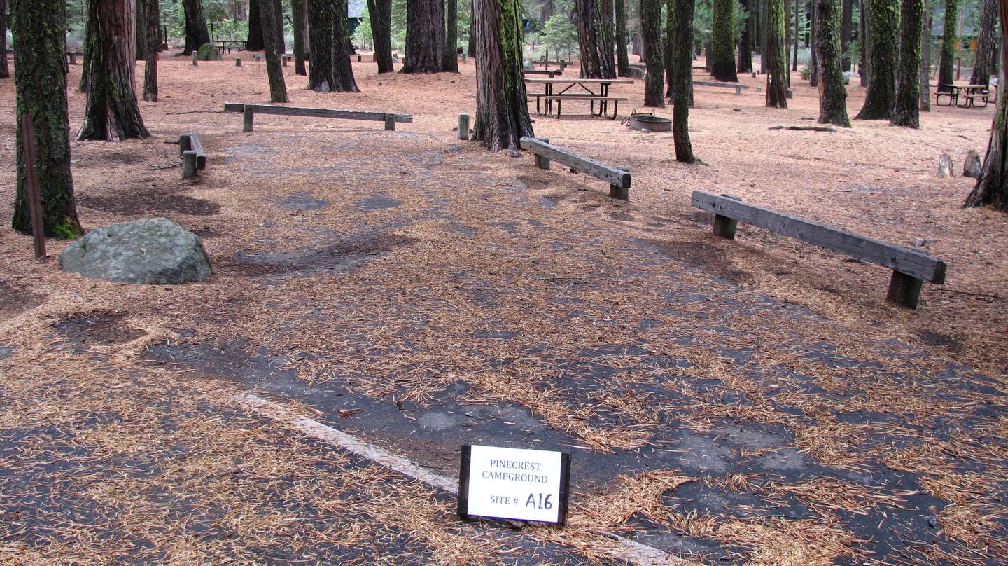 Paved site with picnic table and fire ringPinecrest Campground Site A16