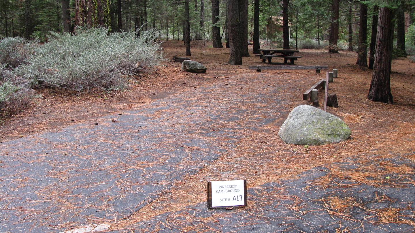 Paved site with picnic table and fire ringPinecrest Campground Site A17