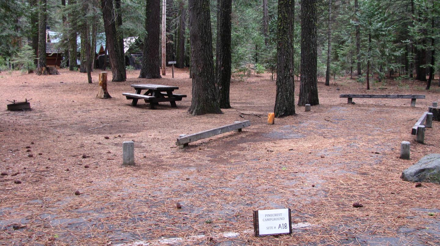 Paved site with picnic table and fire ringPinecrest Campground Site A18