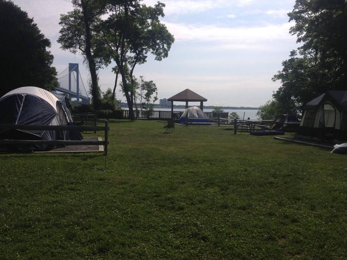 View of the campground with bridge in background- campsites have full sun 