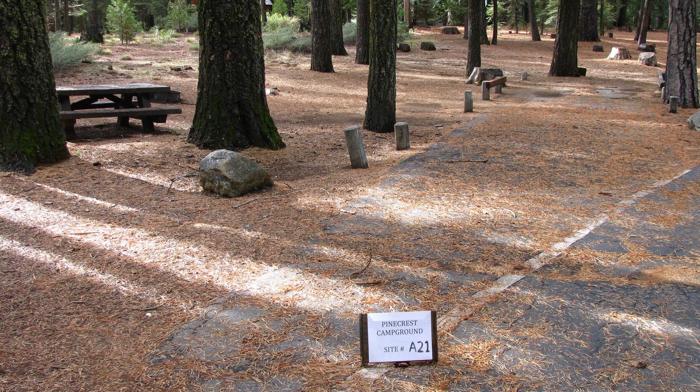 Paved site with picnic table and fire ringPinecrest Campground Site A21