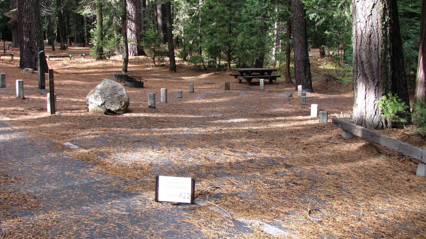 Paved site with picnic table and fire ringPinecrest Campground Site A22