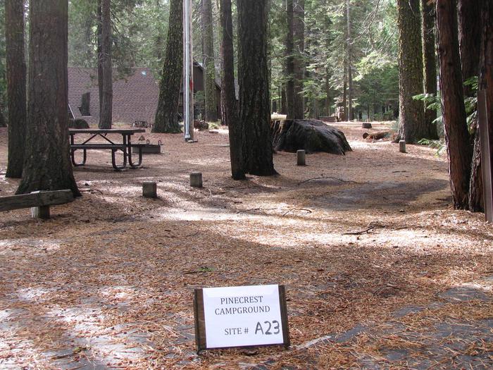 Paved site with picnic table and fire ringPinecrest Campground Site A23